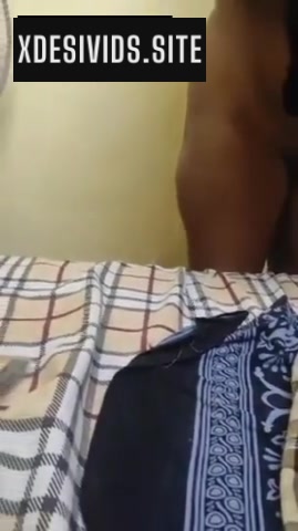 Couple Romancing in a Hotel Room