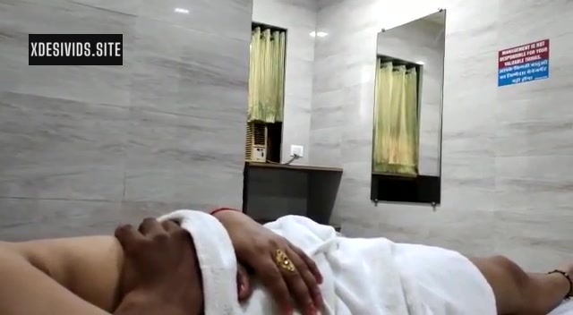 Couple Romancing in a Hotel Room